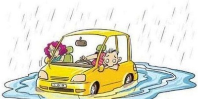 What should new energy vehicles do if they encounter heavy rain or water accumulation?